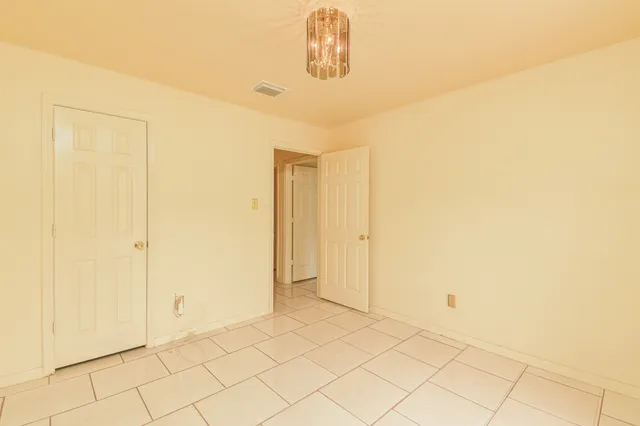 a view of a house with a yard and a garden