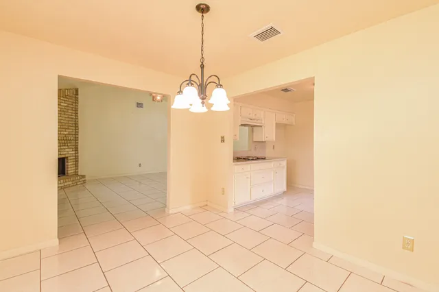 a view of a kitchen with a sink and cabinets