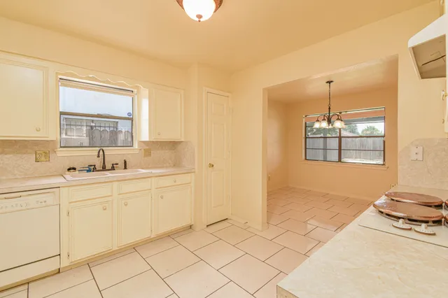 a spacious bathroom with a sink a mirror and a bathtub