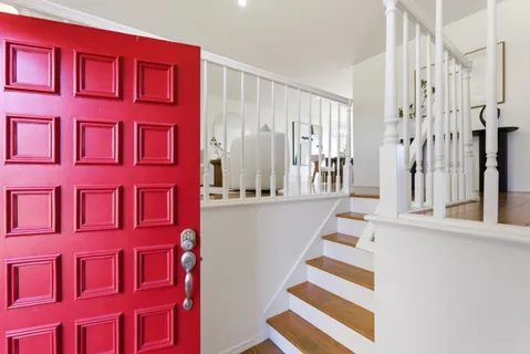 a view of a livingroom with furniture wooden floor and windows