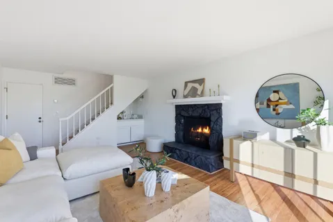 a view of a livingroom with furniture and window