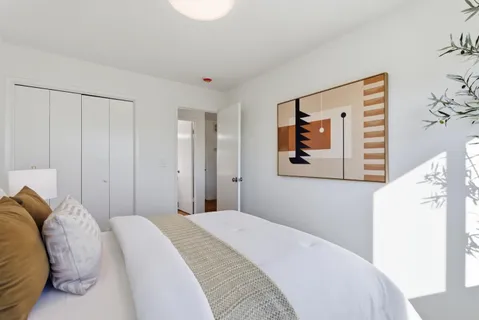 a kitchen with granite countertop a sink a counter top space stainless steel appliances and cabinets