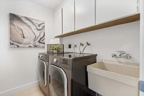 a view of a balcony with wooden floor and outdoor seating