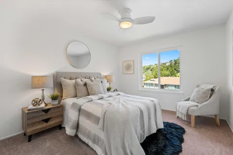 a view of a balcony with chair and wooden floor