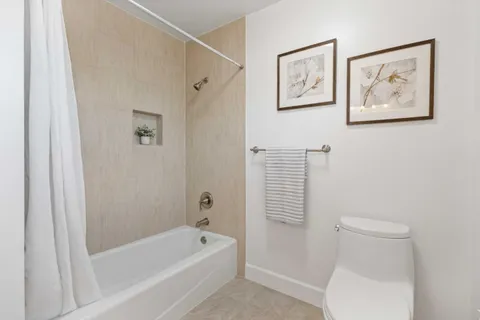 a view of storage and utility room with stainless steel appliances