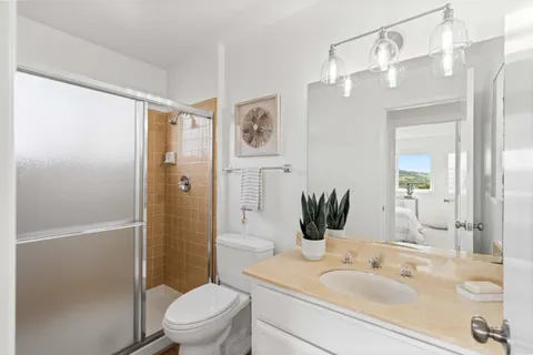 a view of a house with pool and chairs