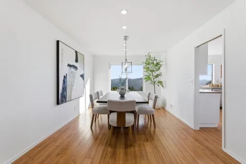 a kitchen with stainless steel appliances granite countertop a sink refrigerator and cabinets