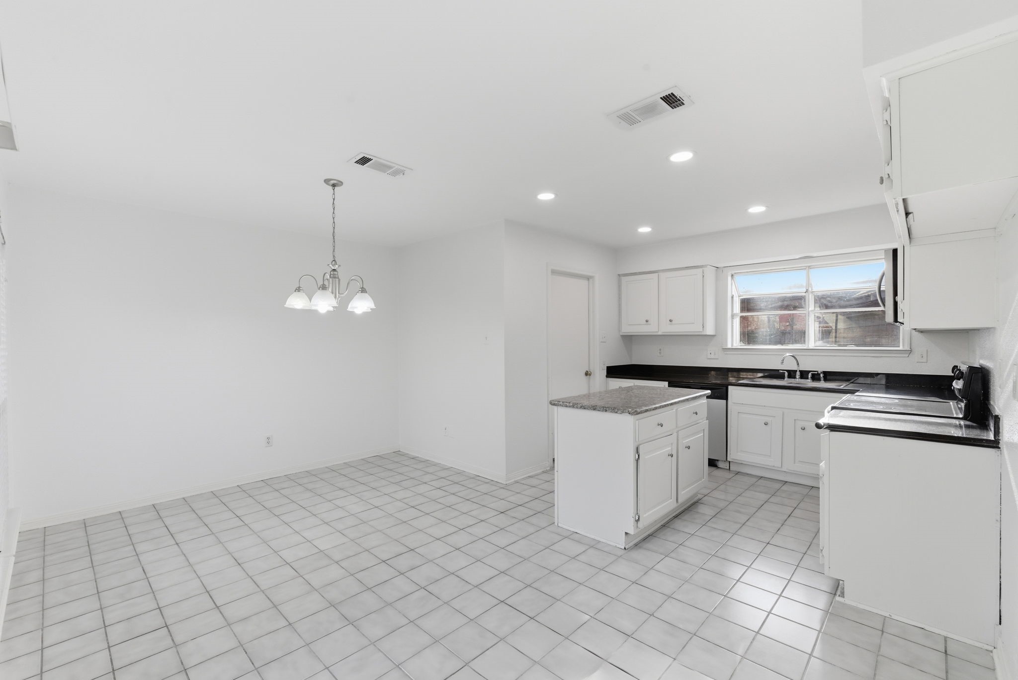 506 Willow Wisp Circle Spring, TX 77388 - Photo 11 of 38 a kitchen with granite countertop white cabinets and white appliances