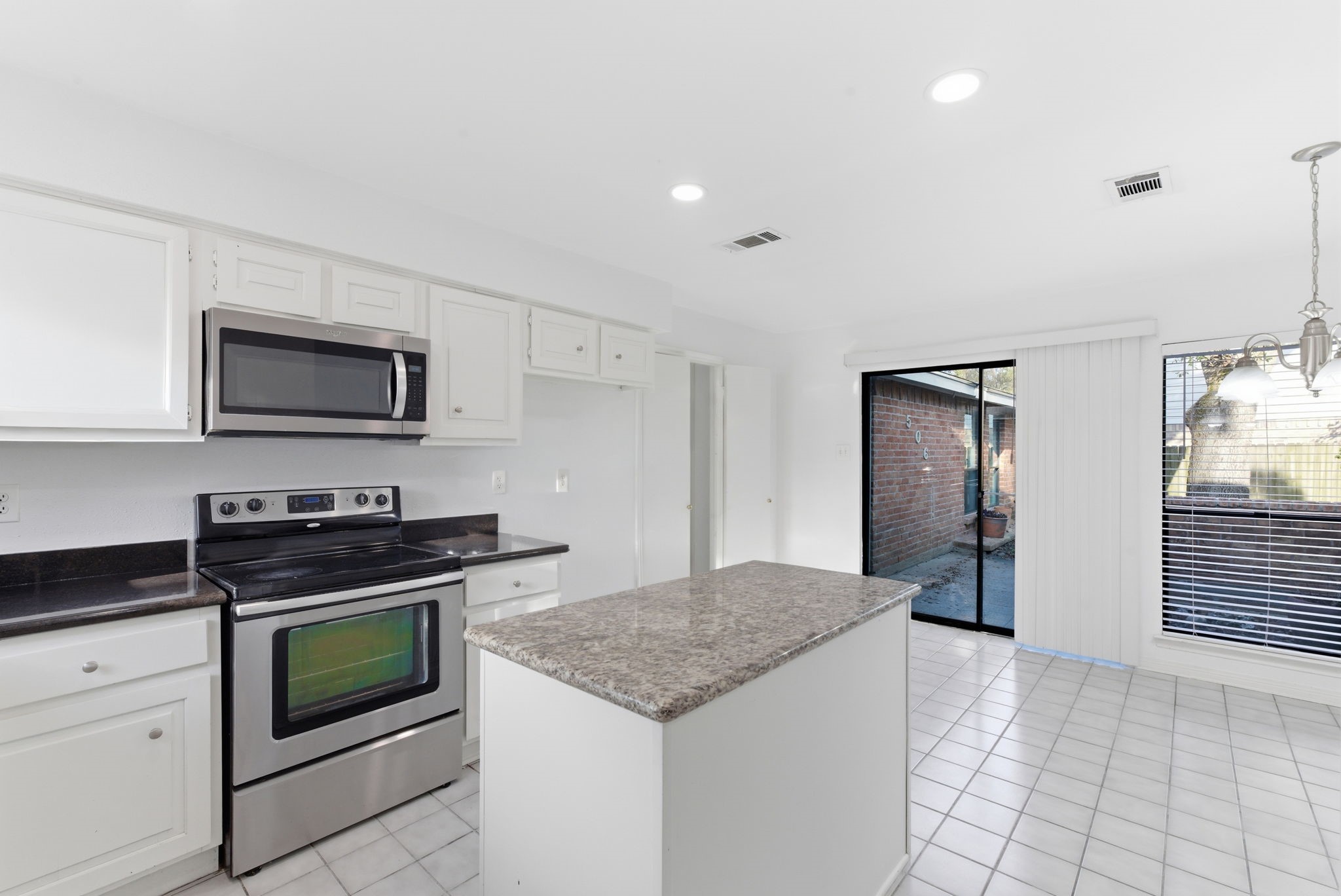 506 Willow Wisp Circle Spring, TX 77388 - Photo 18 of 38 a kitchen with granite countertop a stove and a sink