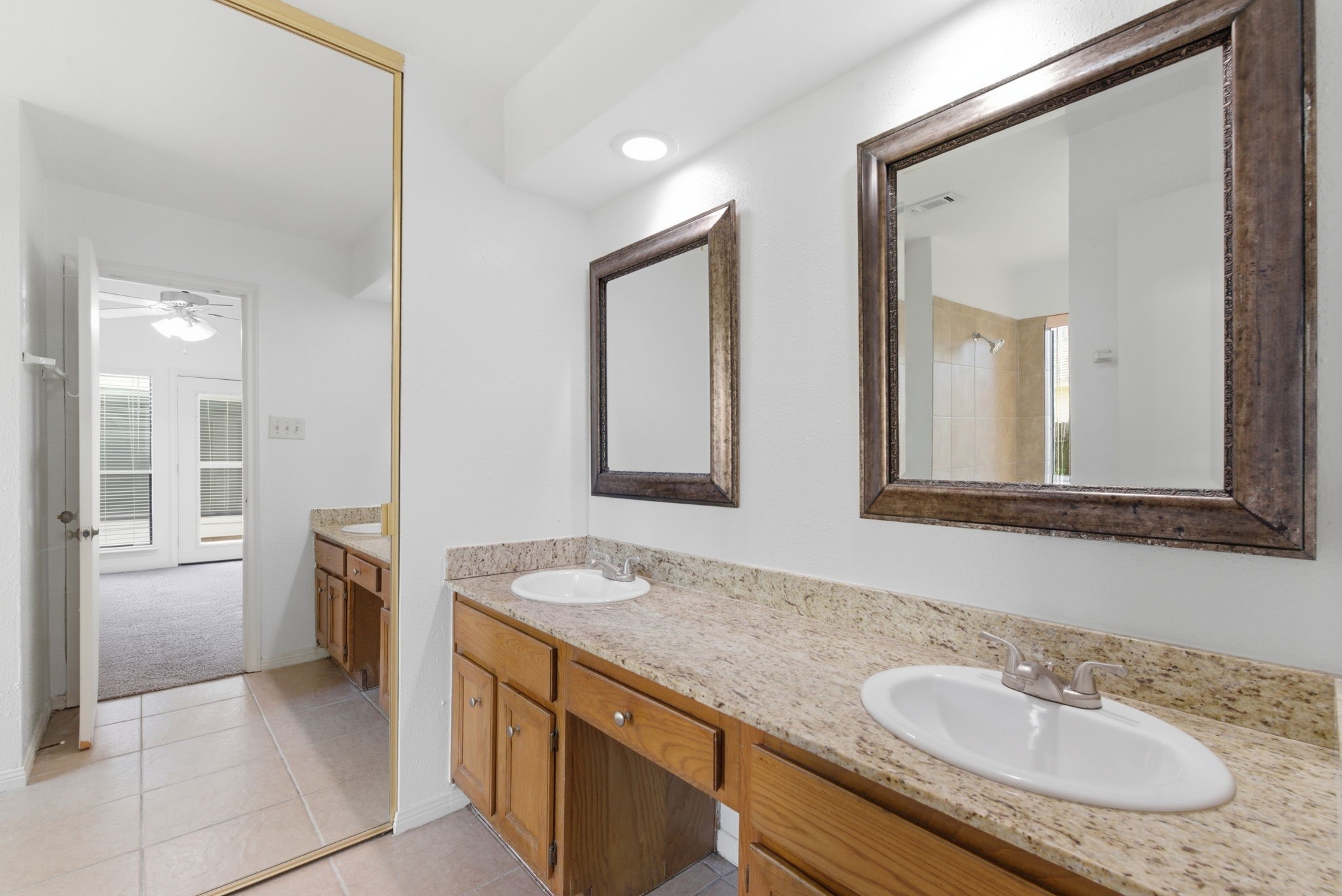 506 Willow Wisp Circle Spring, TX 77388 - Photo 24 of 38 a bathroom with a granite countertop sink and a mirror