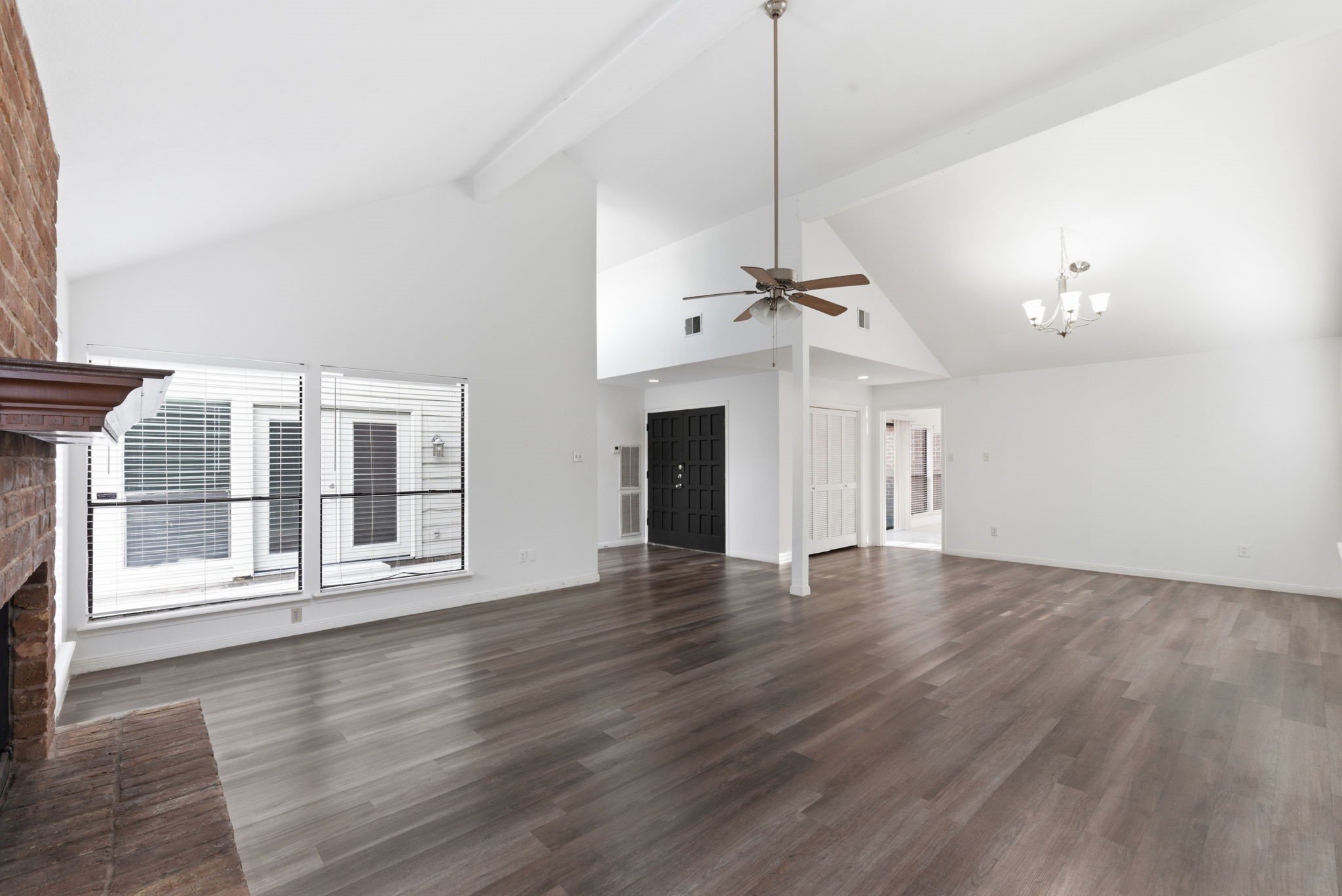 506 Willow Wisp Circle Spring, TX 77388 - Photo 6 of 38 a view of an empty room with wooden floor fireplace and a window