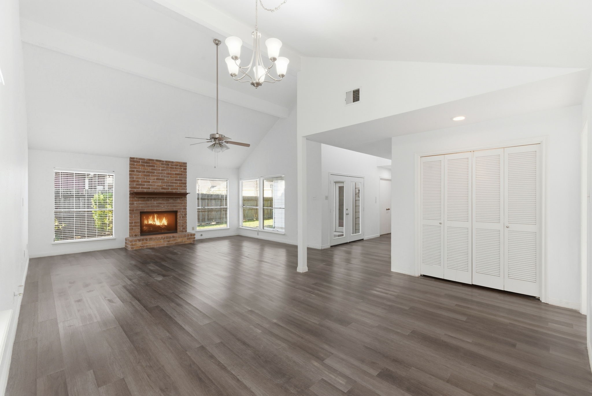 506 Willow Wisp Circle Spring, TX 77388 - Photo 7 of 38 an empty room with wooden floor fireplace and windows