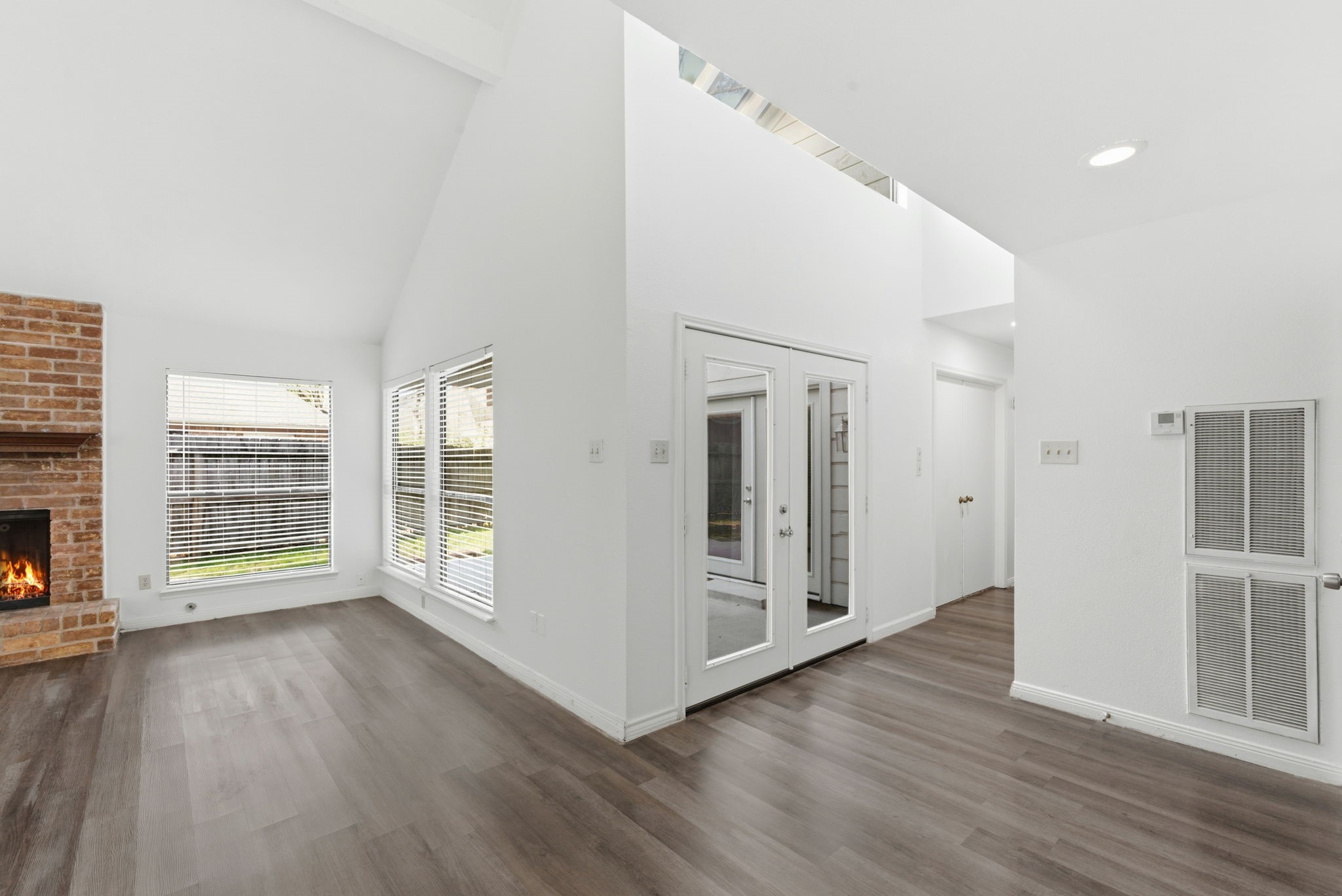 506 Willow Wisp Circle Spring, TX 77388 - Photo 10 of 38 an empty room with wooden floor and windows