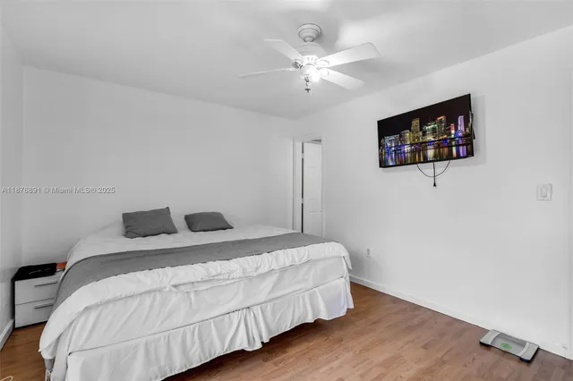 a bedroom with a bed and a lamp