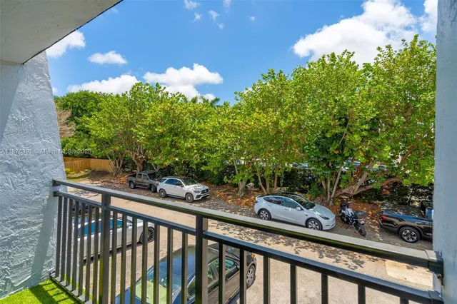 a view of a balcony with plants