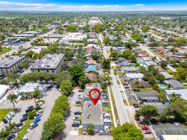 an aerial view of residential building and trees