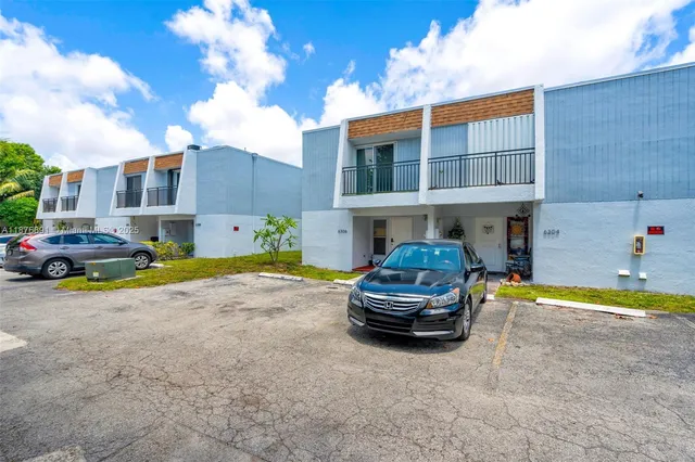 a car parked in front of a house