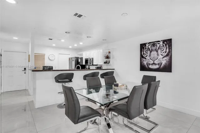 a view of a dining room with furniture