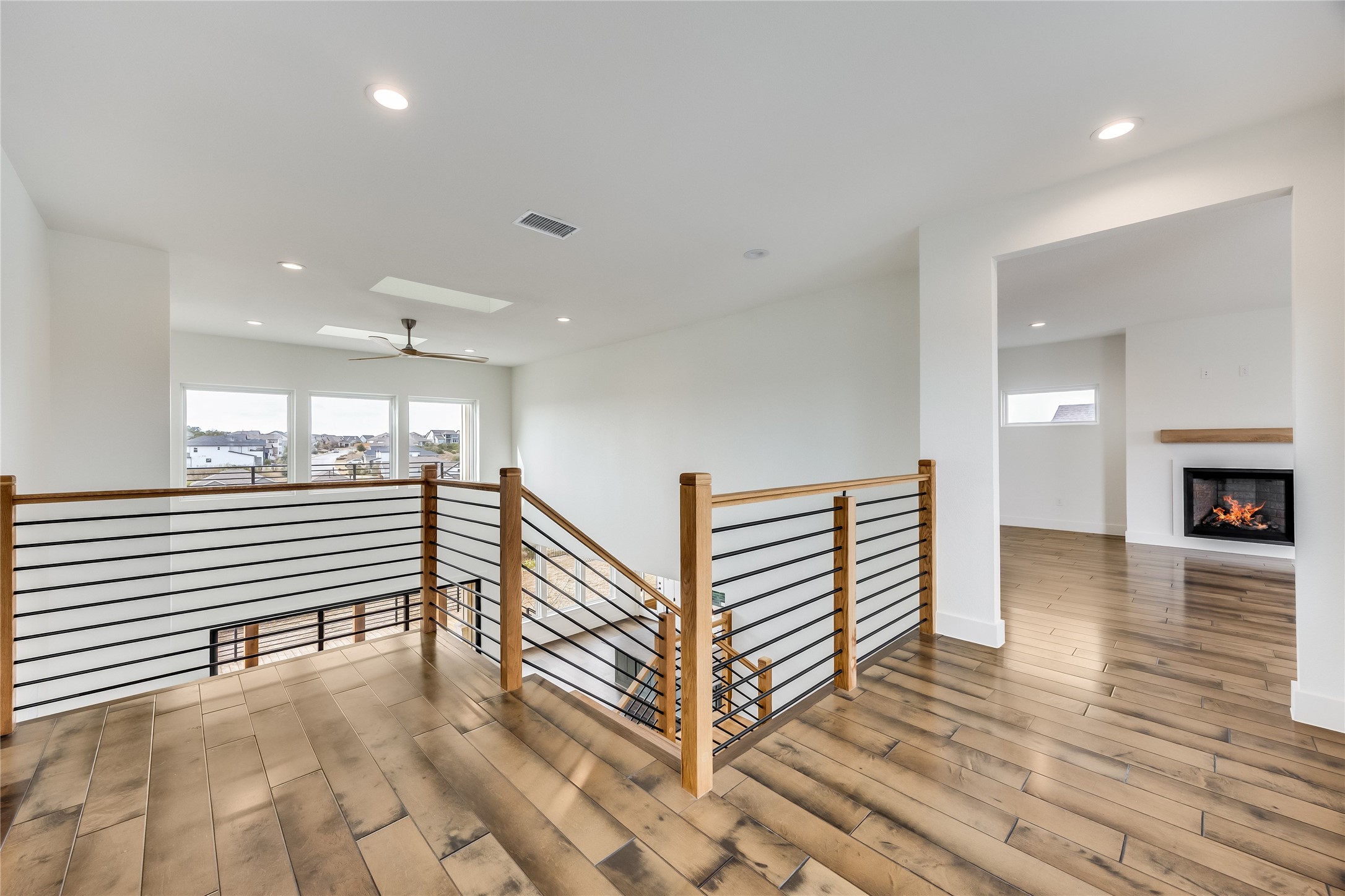 288 Smoke Tree Circle Dripping Springs, TX 78620 - Photo 22 of 40 a view of a hallway with stairs and a window
