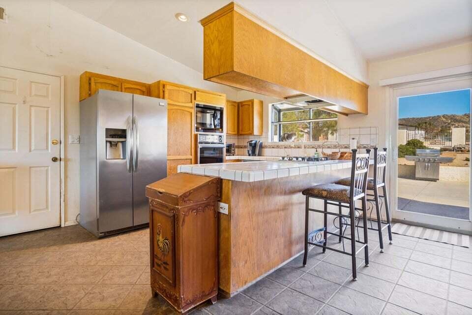 5600 Shannon Valley Road Acton, CA 93510 - Photo 16 of 54 5600 kit cntr gar door slider view