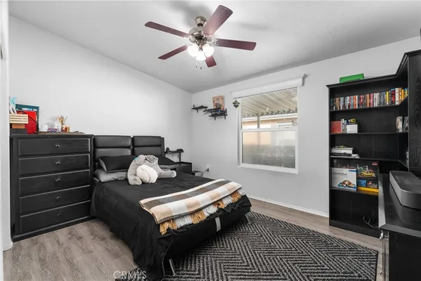 a bedroom with furniture and a window
