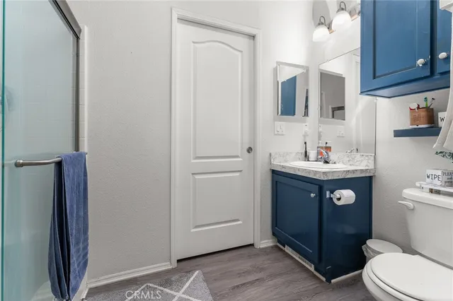 a bathroom with a sink toilet and vanity