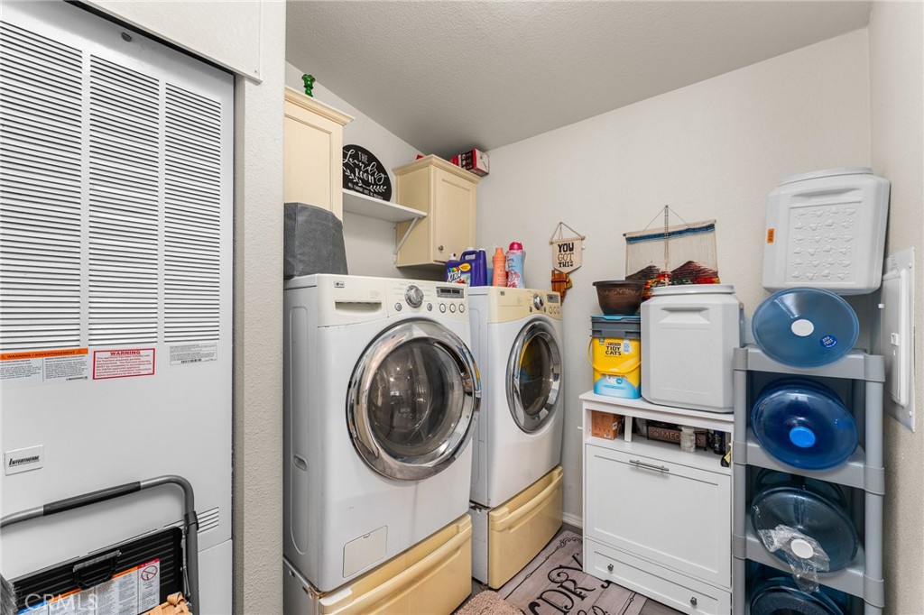 4901 Green River Road, Unit 96 Corona, CA 92878 - Photo 23 of 35 a utility room with dryer and washer