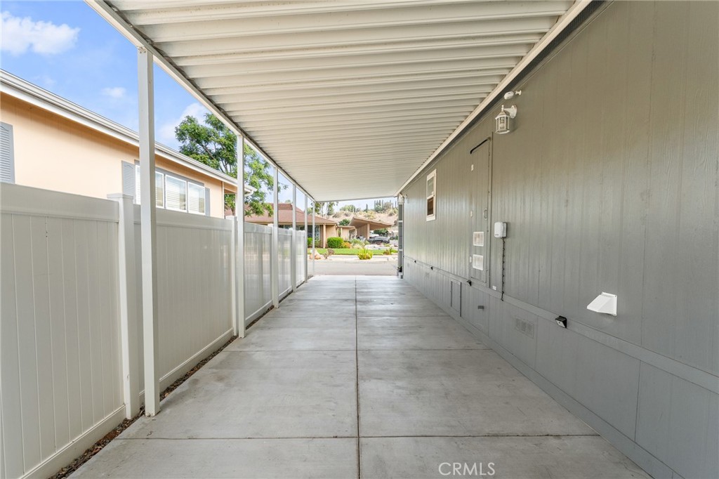 4901 Green River Road, Unit 96 Corona, CA 92878 - Photo 28 of 35 a view of a hallway
