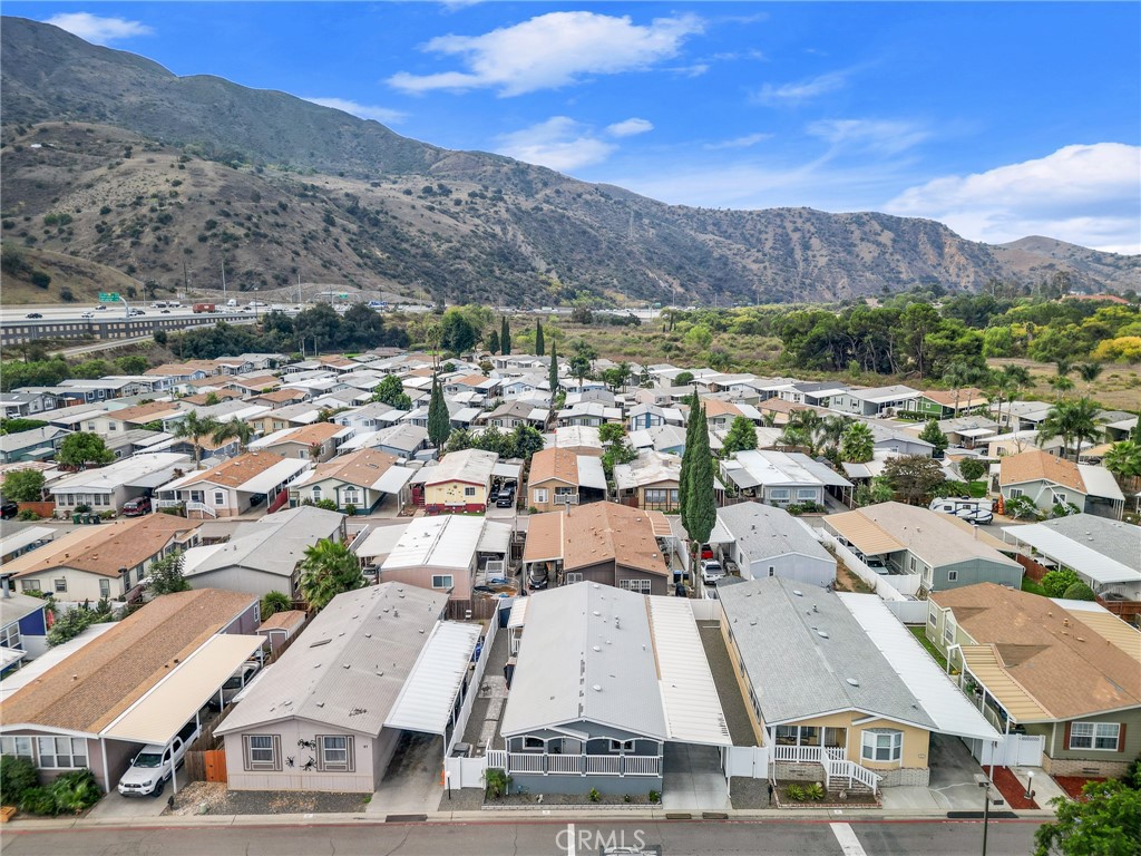 4901 Green River Road, Unit 96 Corona, CA 92878 - Photo 32 of 35 an aerial view of residential houses with outdoor space