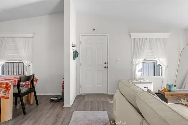 a room with a chair and wooden floor