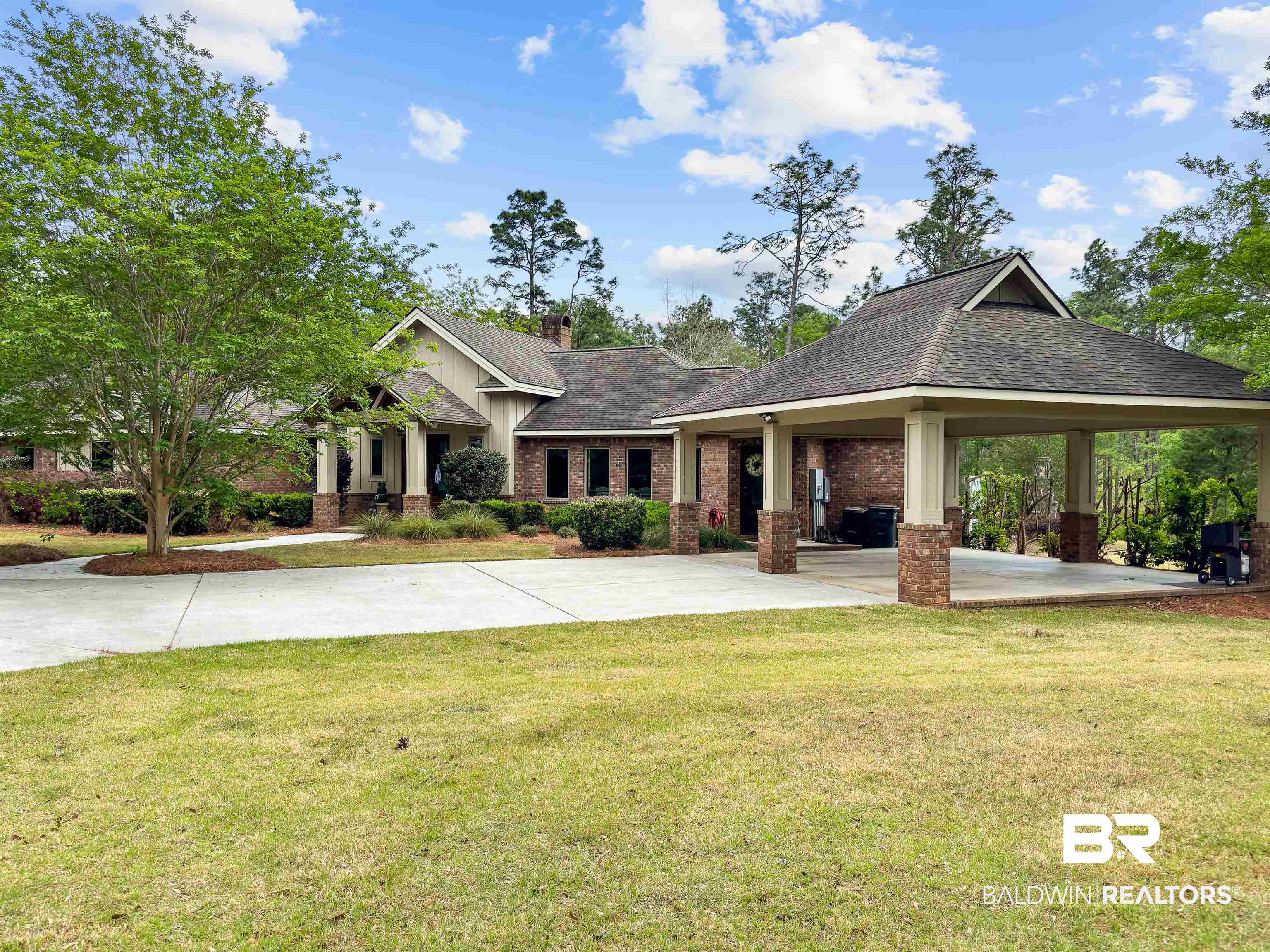 47252 Emmons Road Bay Minette, AL 36507 - Photo 48 of 50 Craftsman-style home with a front lawn, brick siding, and a shingled roof