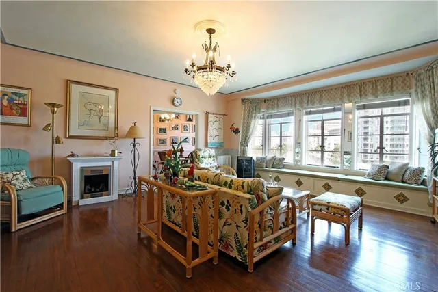 a living room with furniture fireplace and flat screen tv