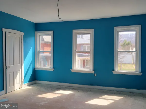 an empty room with windows