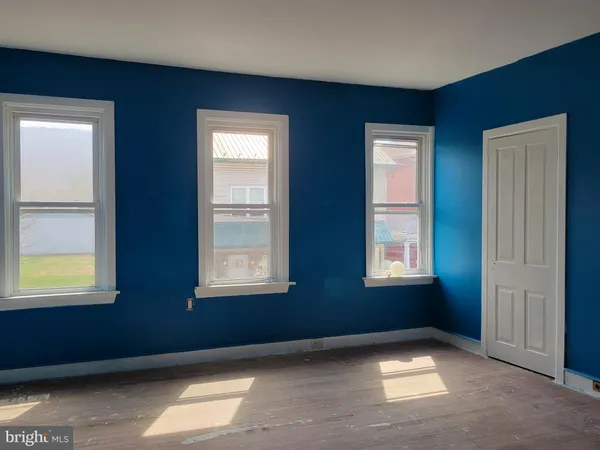 an empty room with windows