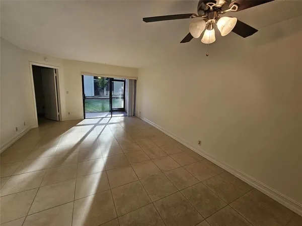 a view of an empty room with a window