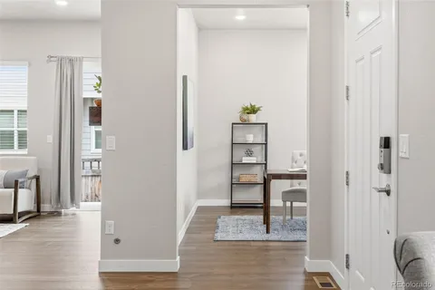 a view of kitchen with furniture and wooden floor