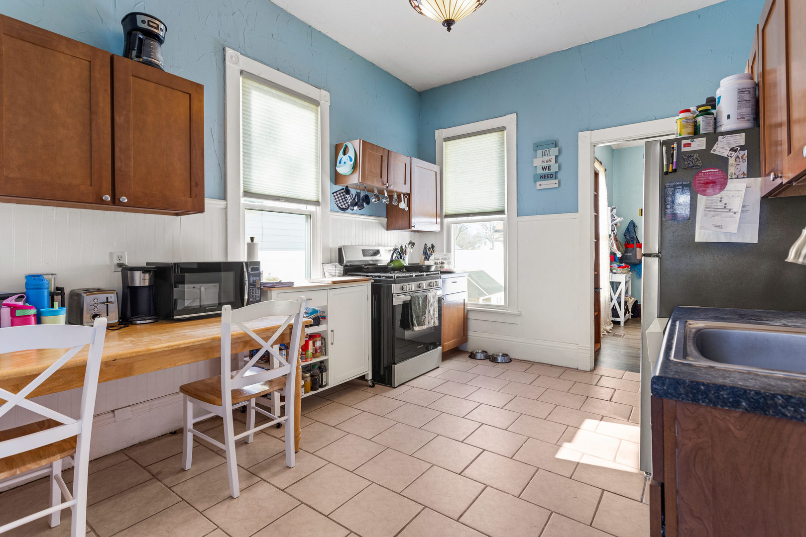 457 South Independence Street Monticello, IL 61856 - Photo 11 of 33 a kitchen with stainless steel appliances granite countertop a stove a sink dishwasher and a refrigerator with cabinets