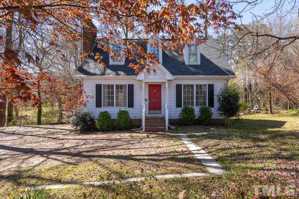 1605 Pagan Road Raleigh, NC 27603 - Photo 1 of 23 a front view of a house with garden