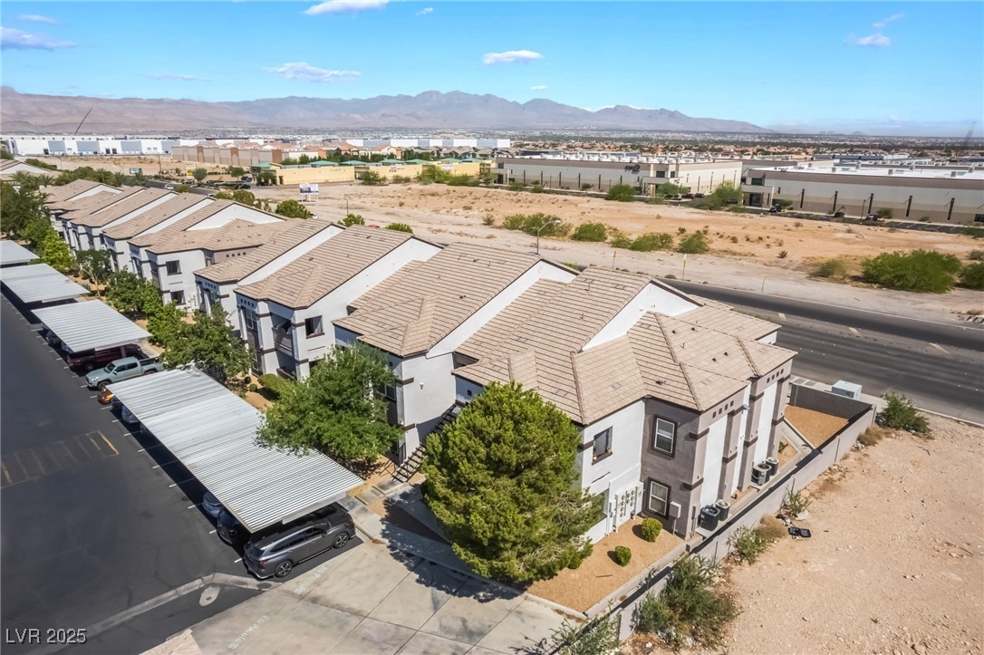 7255 West Sunset Road, Unit 1148 Las Vegas, NV 89113 - Photo 47 of 62 Aerial perspective of suburban area with mountains