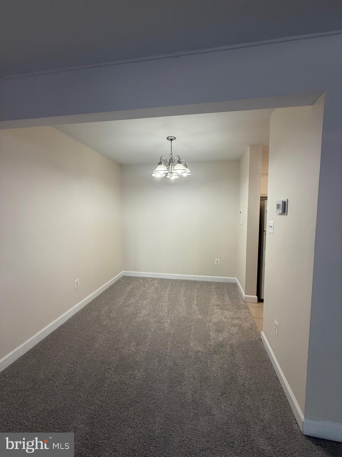4118 Peppertree Lane, Unit 4118 Silver Spring, MD 20906 - Photo 12 of 30 en empty room with windows and ceiling fan