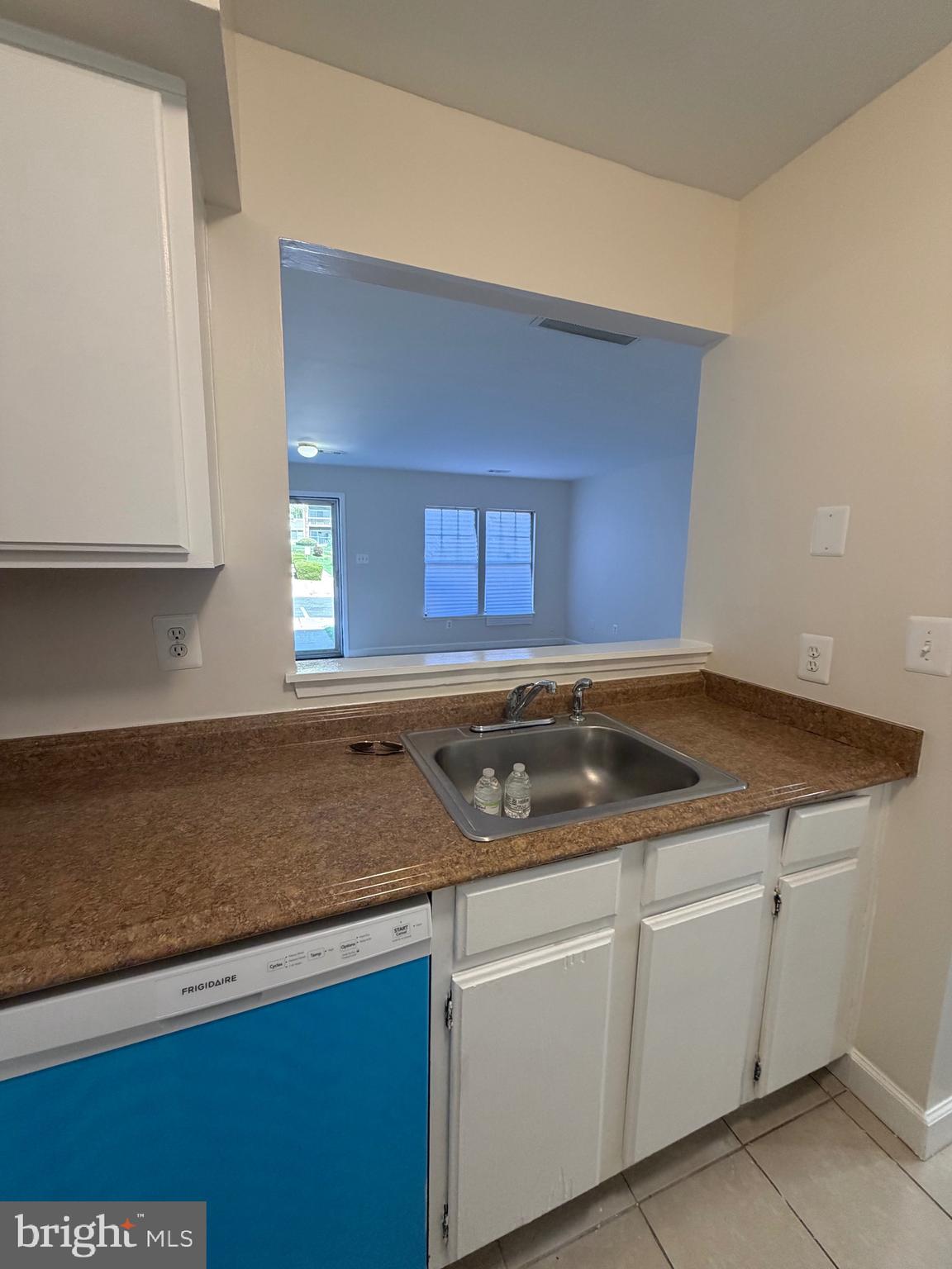 4118 Peppertree Lane, Unit 4118 Silver Spring, MD 20906 - Photo 15 of 30 a kitchen with granite countertop white cabinets and a stove