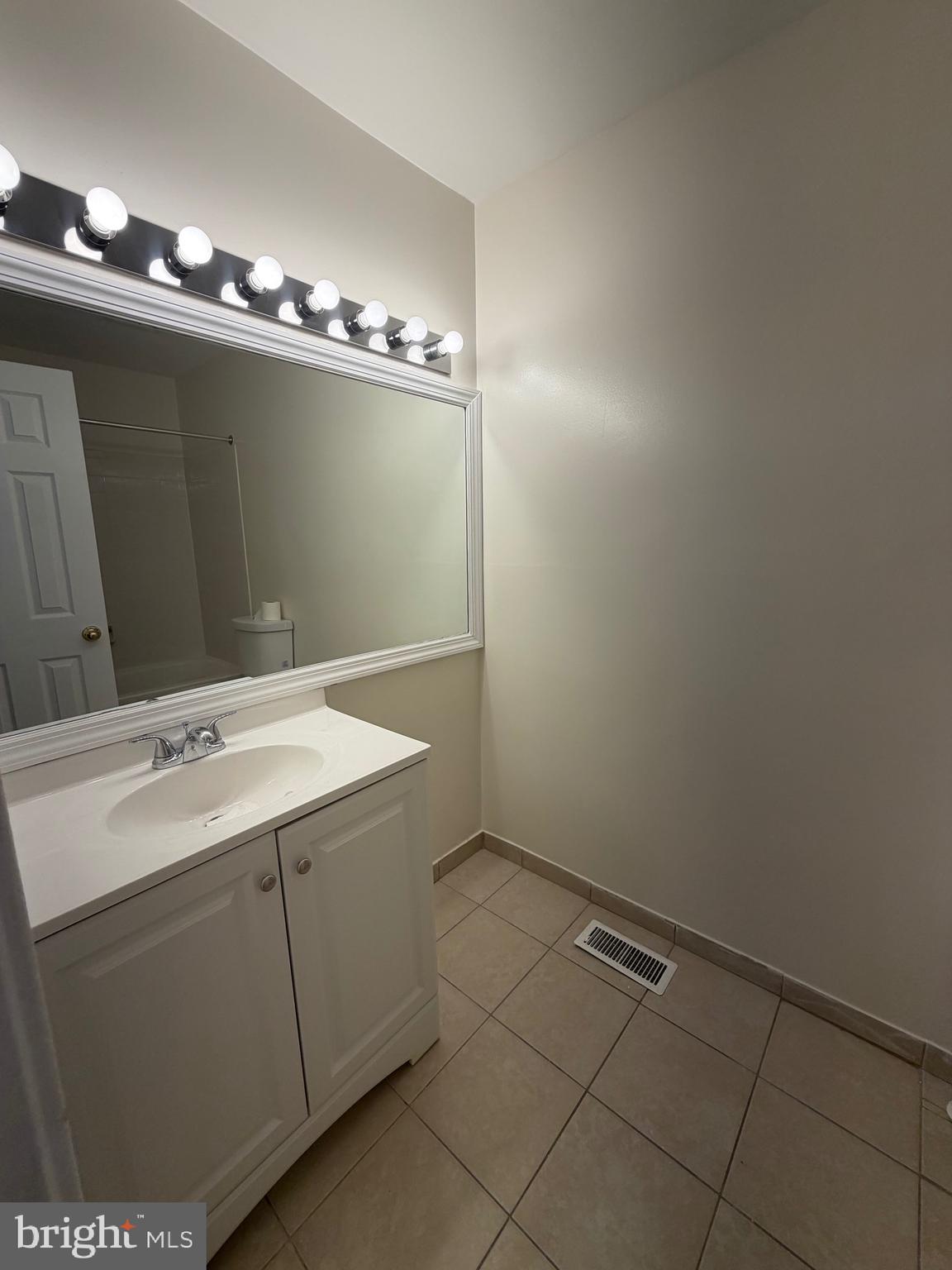 4118 Peppertree Lane, Unit 4118 Silver Spring, MD 20906 - Photo 17 of 30 a utility room with closet and wooden floor