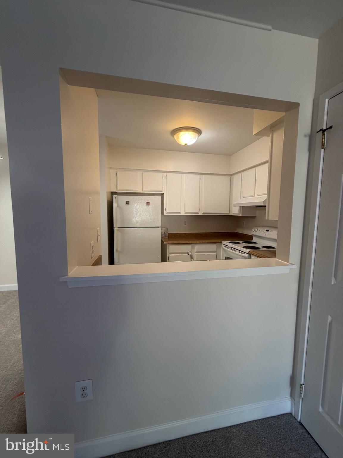 4118 Peppertree Lane, Unit 4118 Silver Spring, MD 20906 - Photo 3 of 30 a close view of stove top oven and cabinets