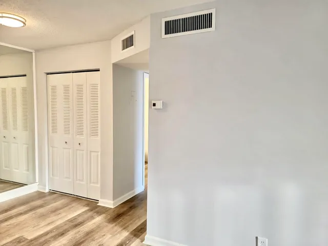 a view of entryway with wooden floor