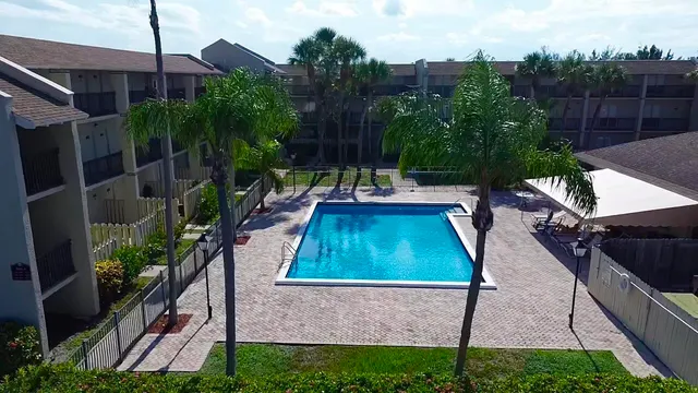 a view of a backyard with plants and a patio