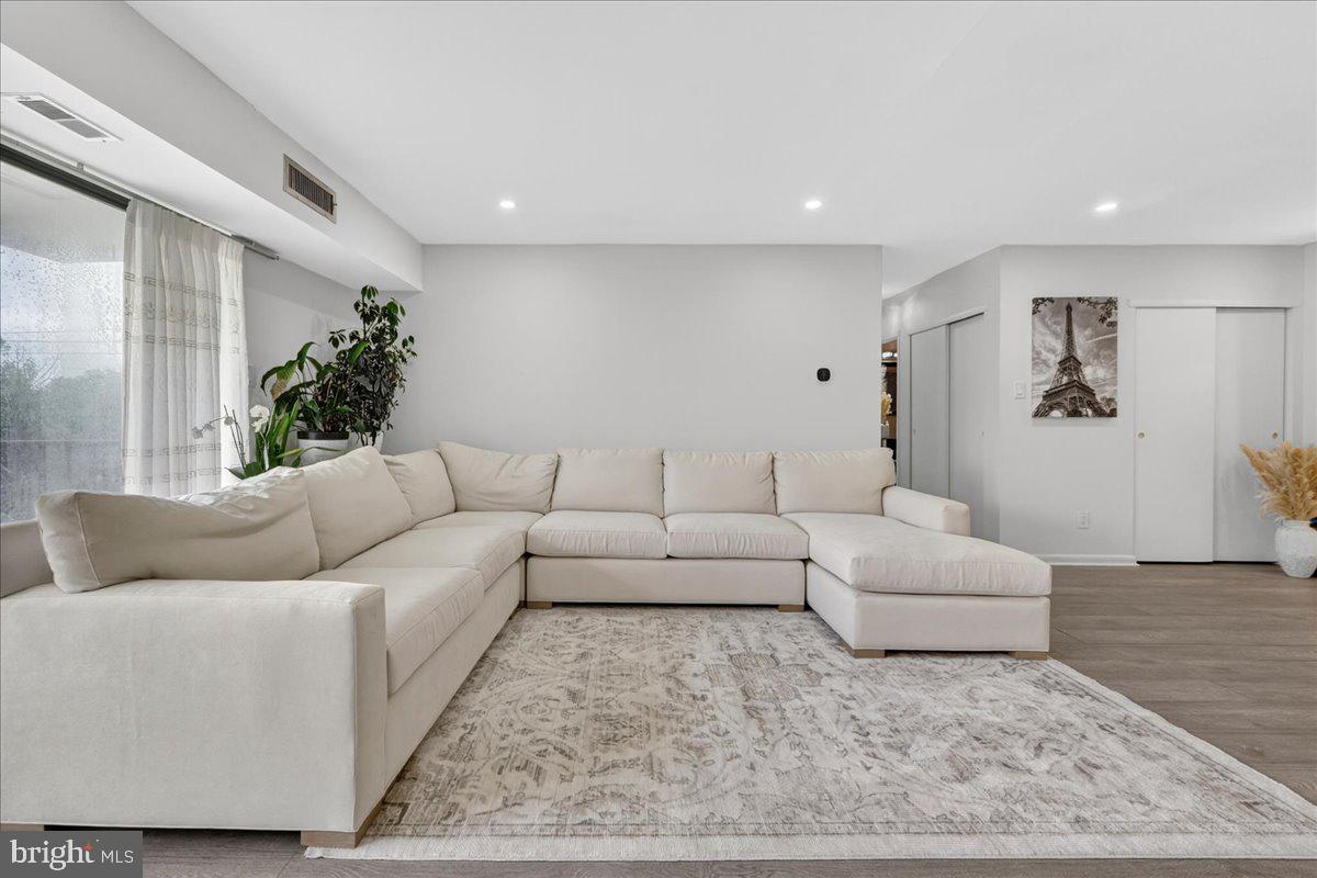 8930 Krewstown Road, Unit 310 Philadelphia, PA 19115 - Photo 3 of 32 a living room with furniture and a couch