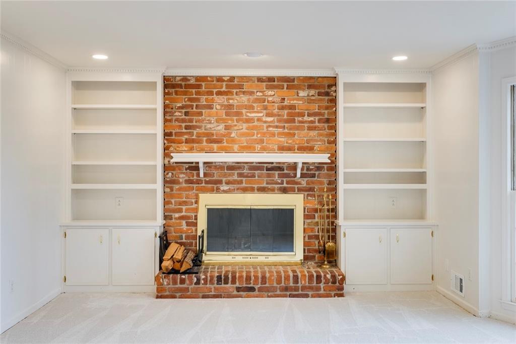 1416 Vernon Ridge Close Atlanta, GA 30338 - Photo 11 of 59 a living room with a fireplace