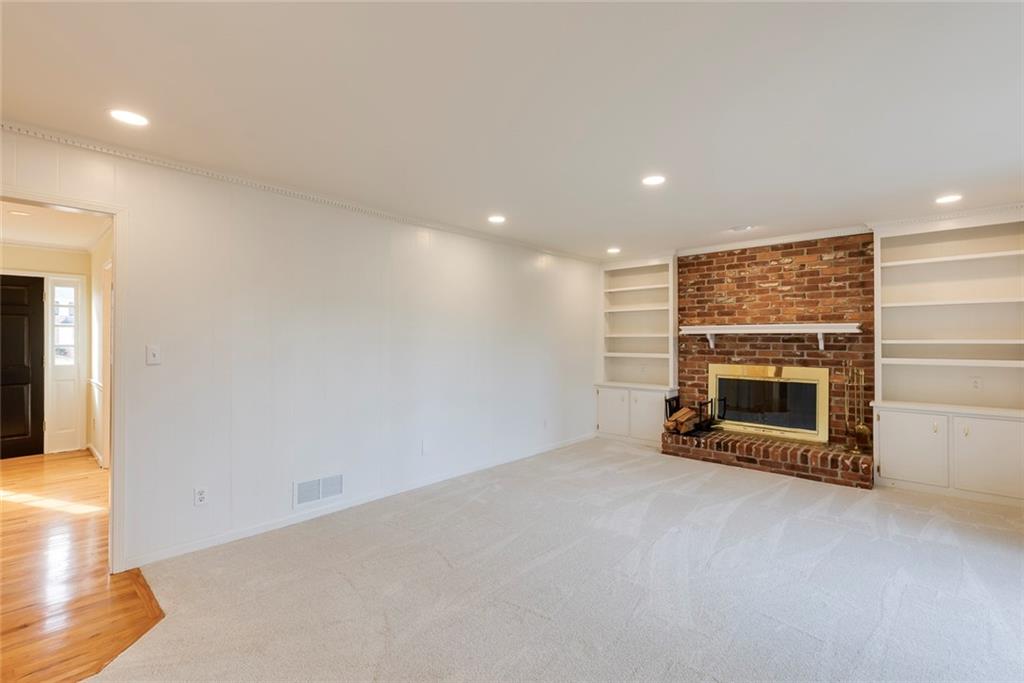 1416 Vernon Ridge Close Atlanta, GA 30338 - Photo 12 of 59 a view of an empty room with a fireplace