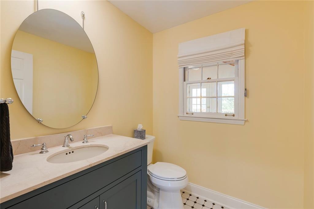 1416 Vernon Ridge Close Atlanta, GA 30338 - Photo 14 of 59 a bathroom with a sink and a mirror