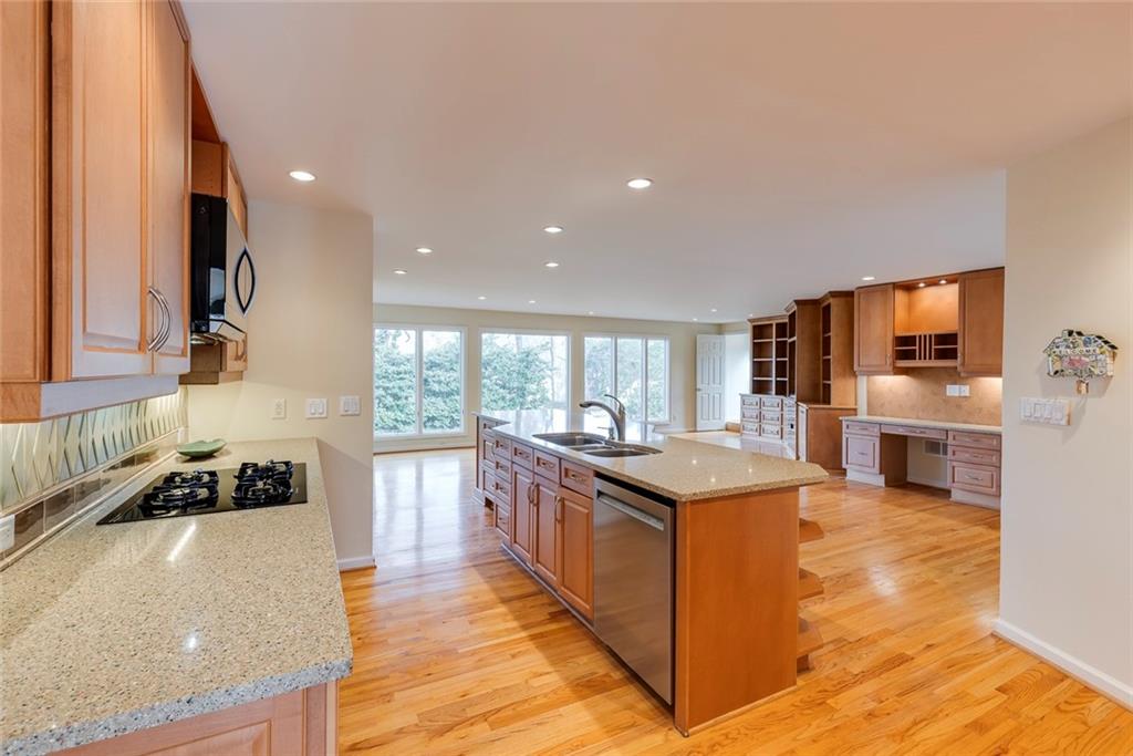 1416 Vernon Ridge Close Atlanta, GA 30338 - Photo 15 of 59 a kitchen with stainless steel appliances granite countertop a stove and a sink